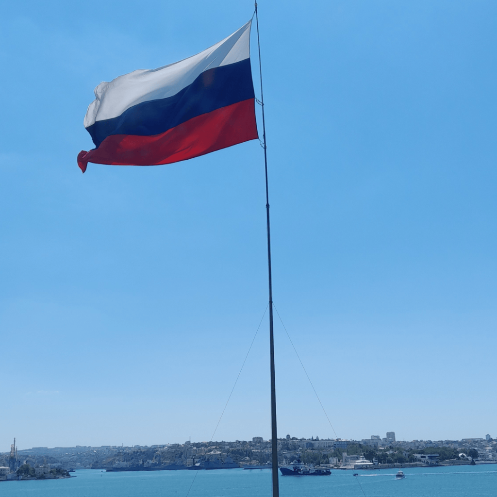 Russian flag flying above Sevastopol Bay in Crimea