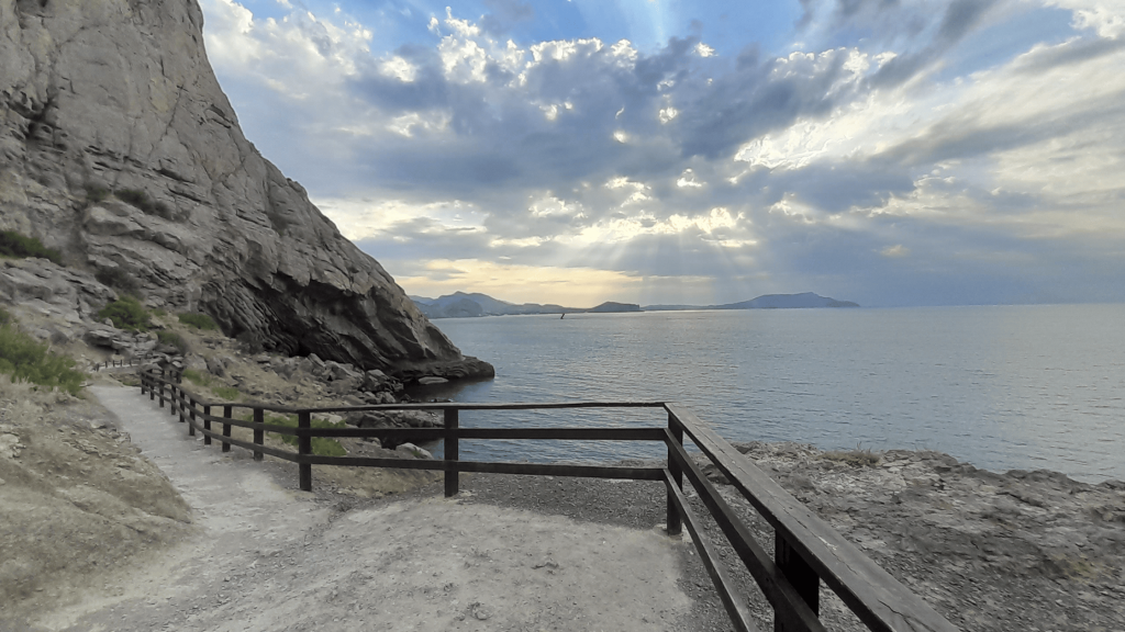Panoramic view of the Black Sea from the Golitsyn Trail with sun rays through clouds