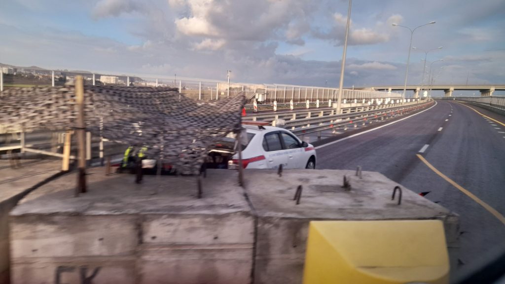 Security checkpoint on the Crimean Bridge highway connecting mainland Russia to Crimea with inspection lanes