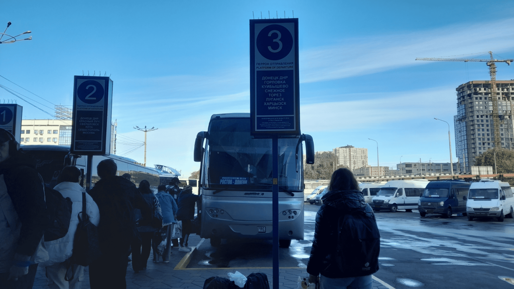 Passengers boarding the Rostov-to-Donetsk bus at Platform 3 of the Rostov bus station.