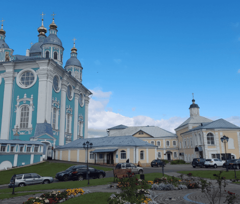 Assumption Cathedral in Smolensk Russia, pastel blue Orthodox church with golden domes and city view