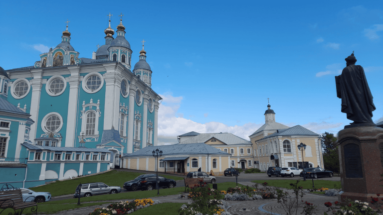 Assumption Cathedral in Smolensk Russia, pastel blue Orthodox church with golden domes and city view