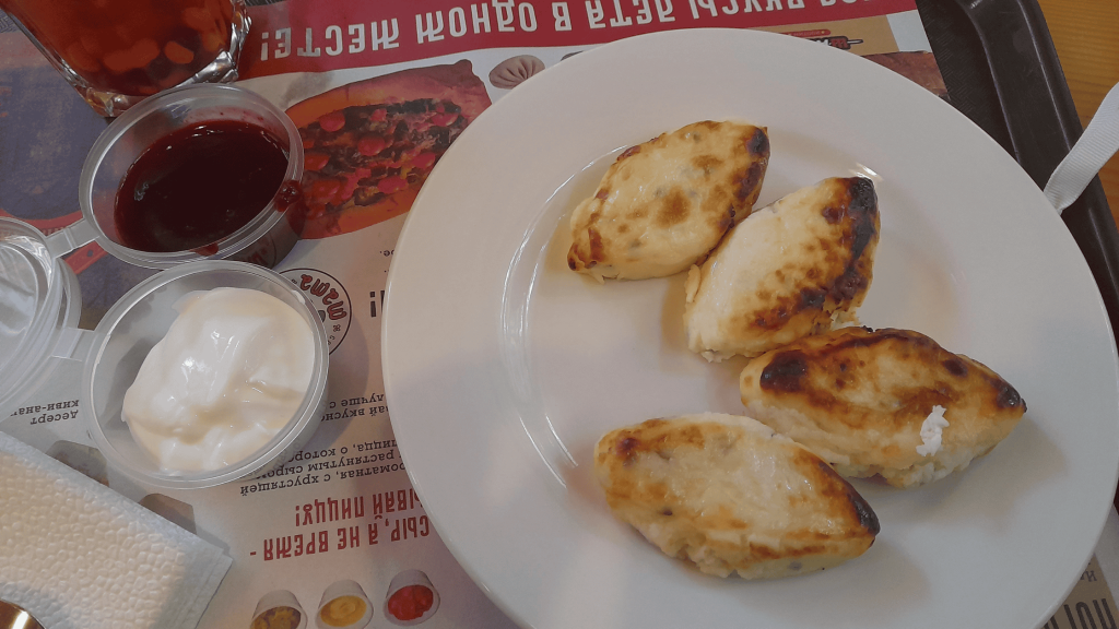 Traditional lapun pancakes from Smolensk served with sour cream and jam – Russian local food