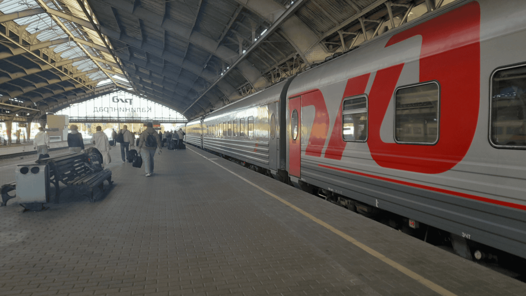 Kaliningrad railway station with RZD train to Minsk, passengers boarding journey