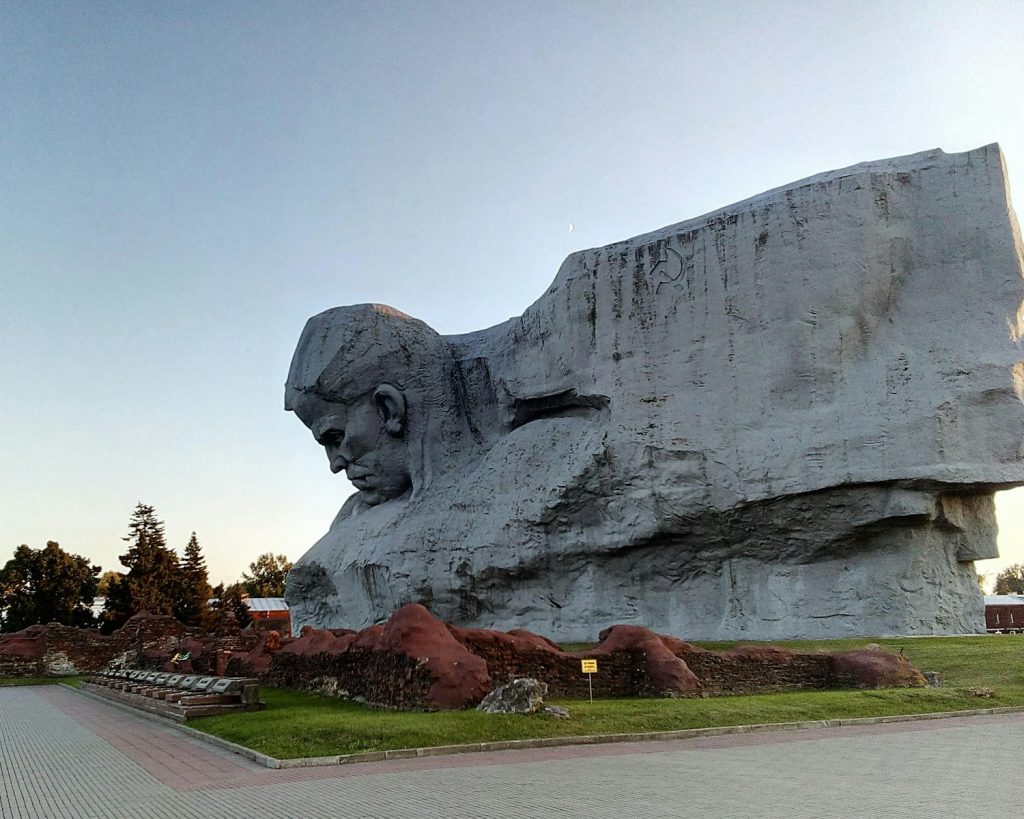 Monumental sculpture of a man's head carved into rock