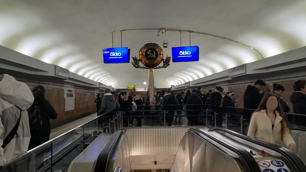 Crowded Lenin Square metro station platform in Minsk