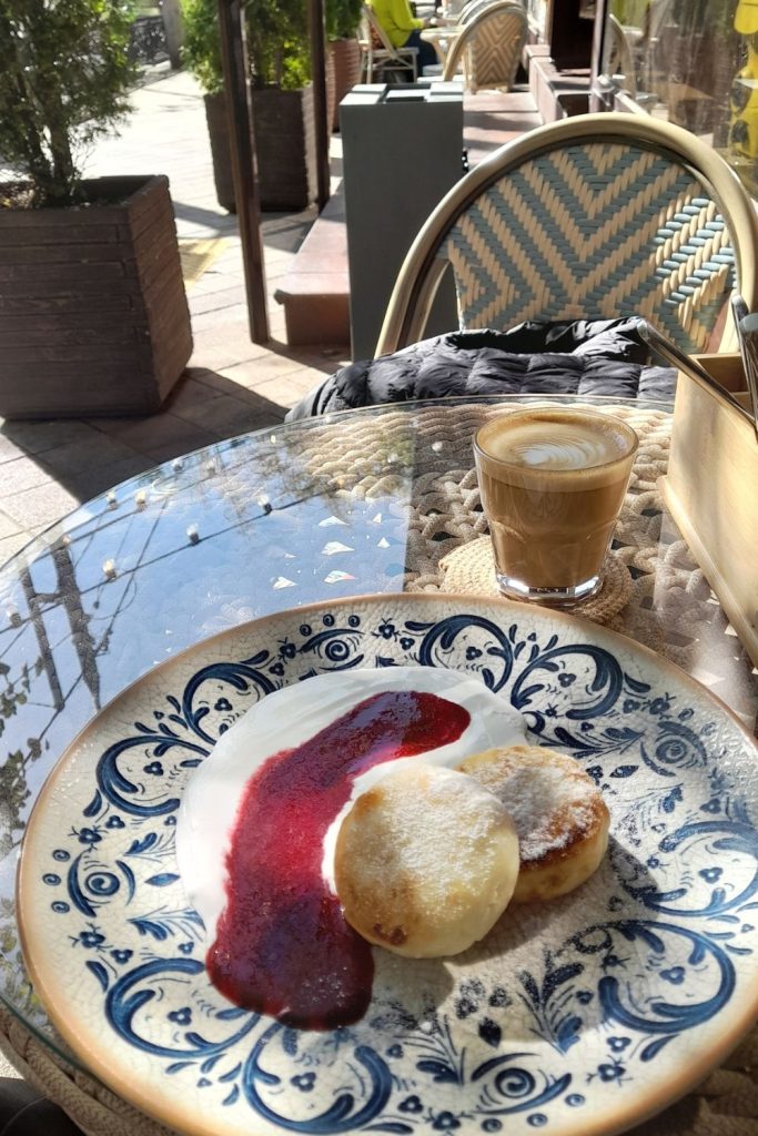 Syrniki with sour cream and coffee in a café in Krasnodar Russia