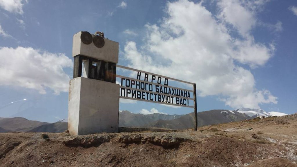 Road sign welcoming travellers to Gorno-Badakhshan in Tajikistan on the Pamir Highway written in Russian