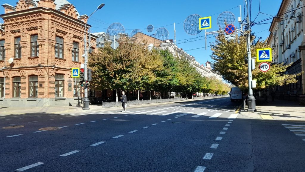 View of Krasnaya Street in Krasnodar with historic buildings and tree-lined avenue in southern Russia