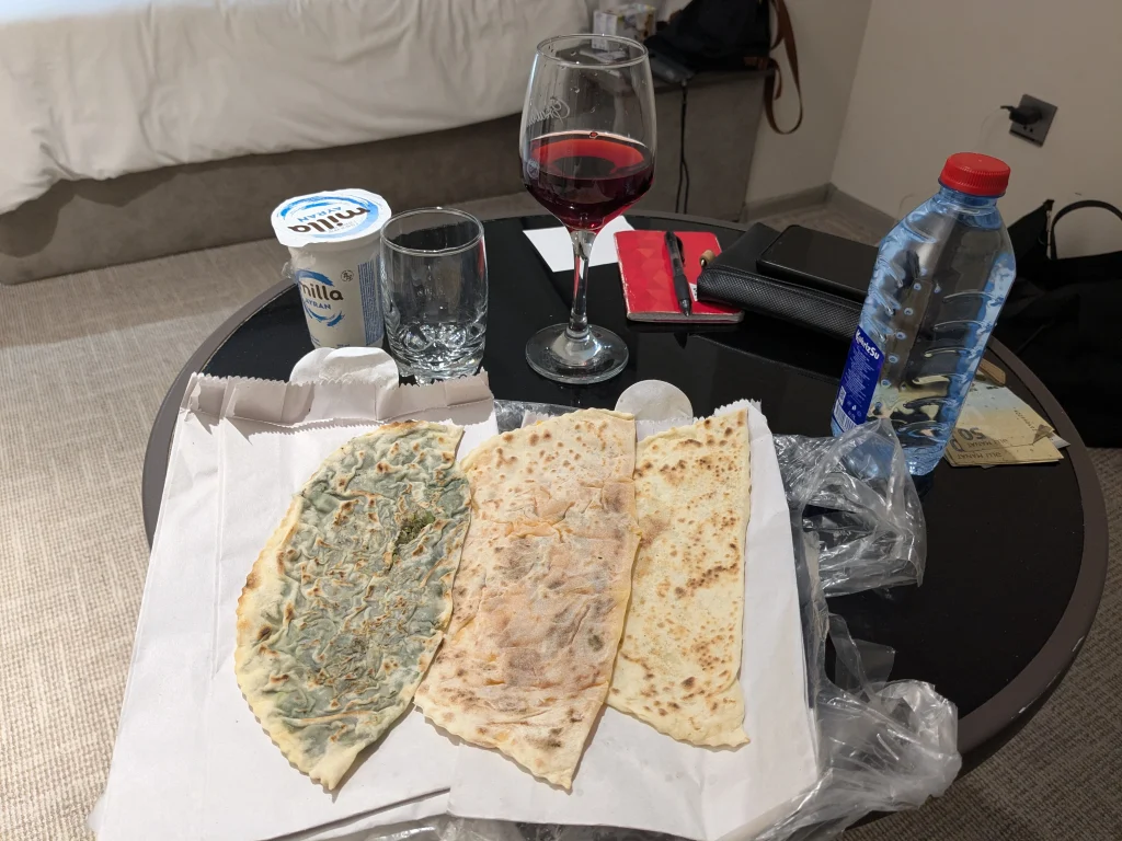 Assorted Azerbaijani qutab served with pomegranate wine in Baku