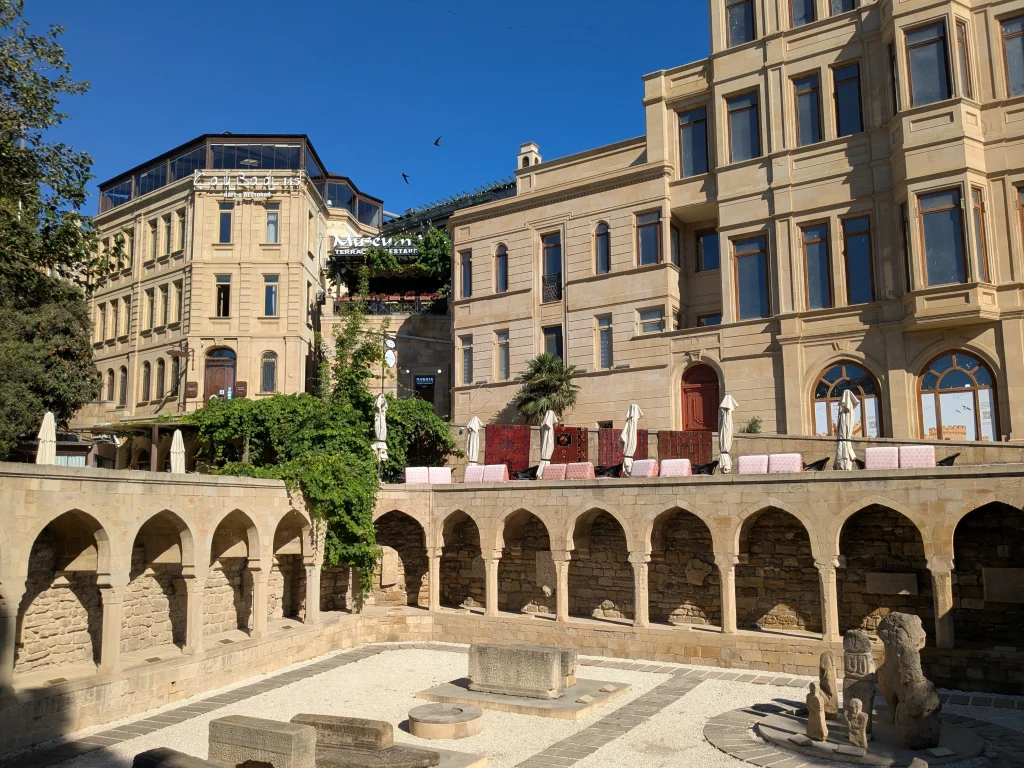 Historic stone courtyard and traditional buildings in Icherisheher
