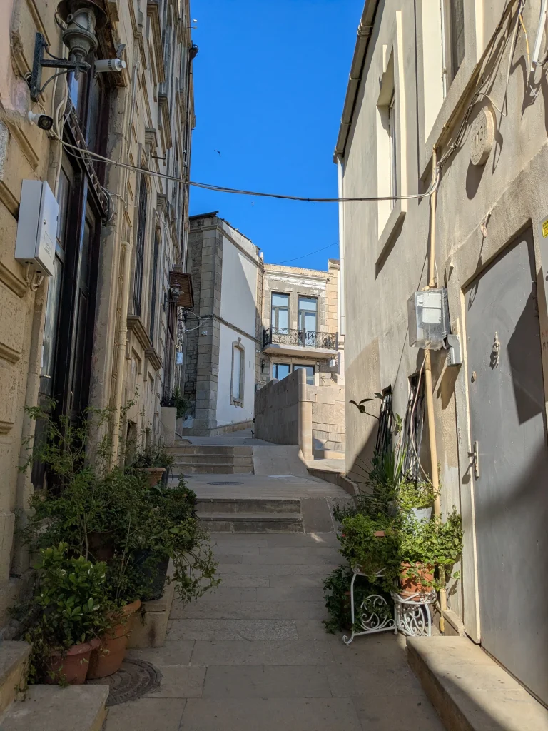 Narrow stepped street between historic stone houses in Icherisheher