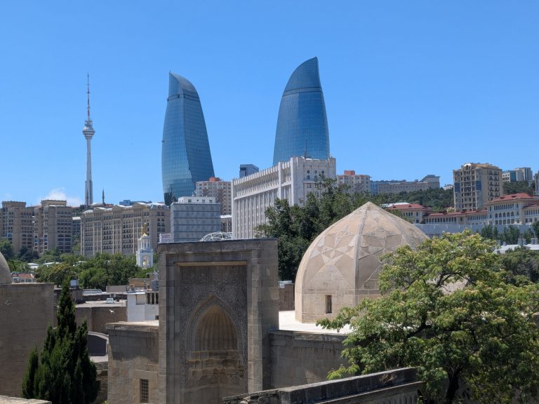 Shirvanshah Palace with Baku Flame Towers in the background
