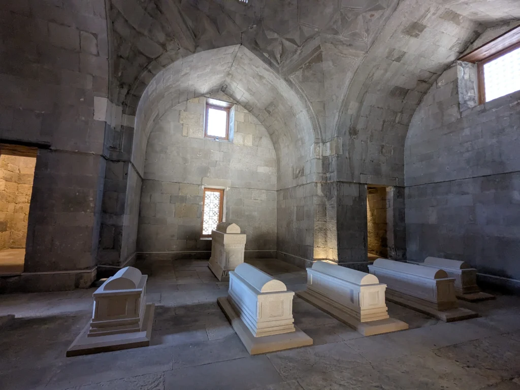 Historic stone interior with tombs inside Shirvanshah Palace in Baku